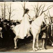 Photo of Inez sitting on white horse